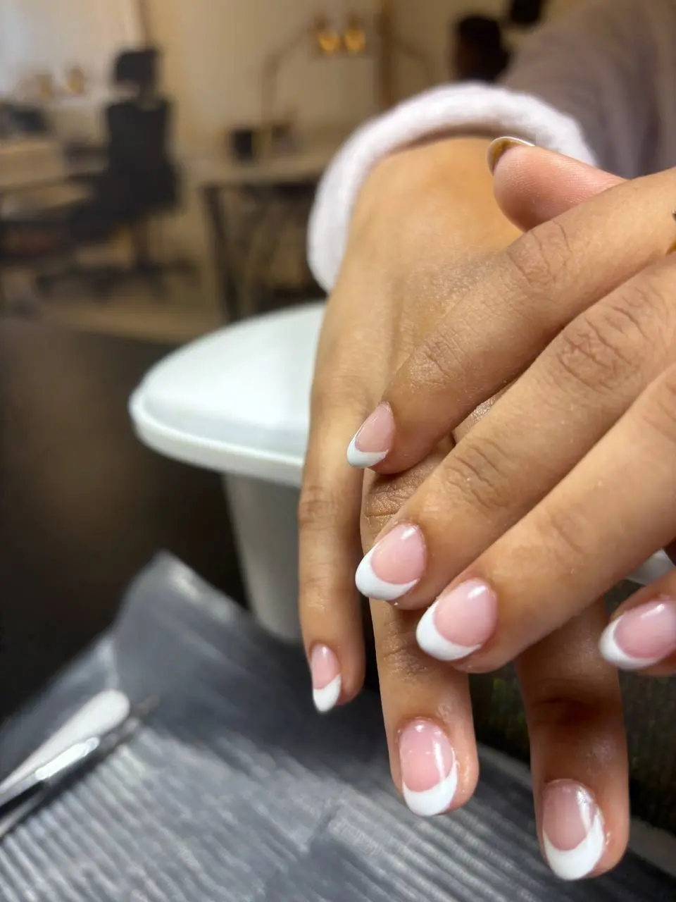 Almond French tip manicure at NailLou Salon