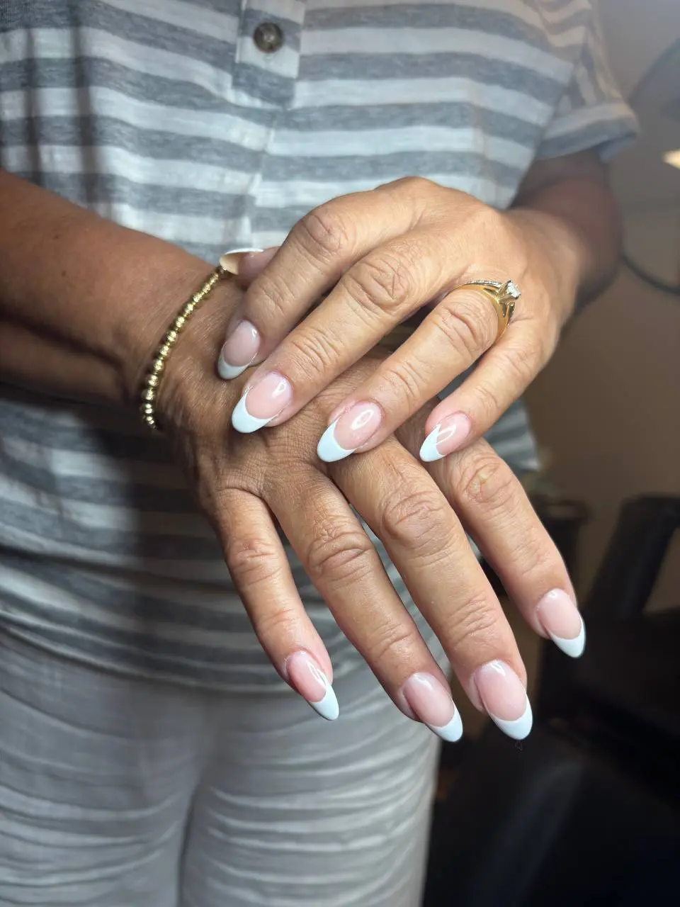 Long white French tip manicure at NailLou Salon