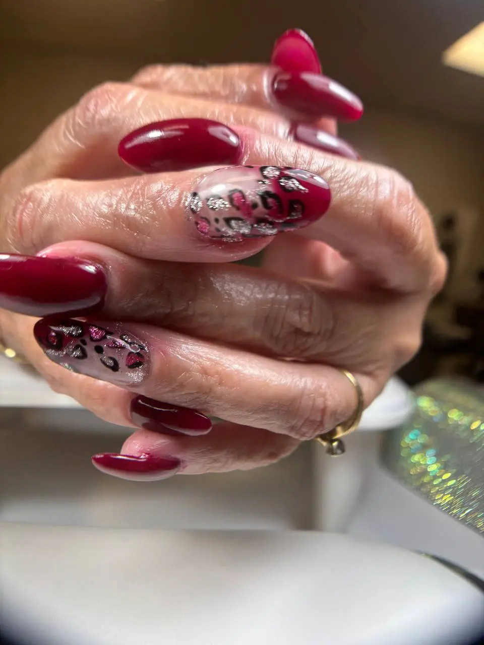 Wine and pink leopard print nail art at NailLou Salon