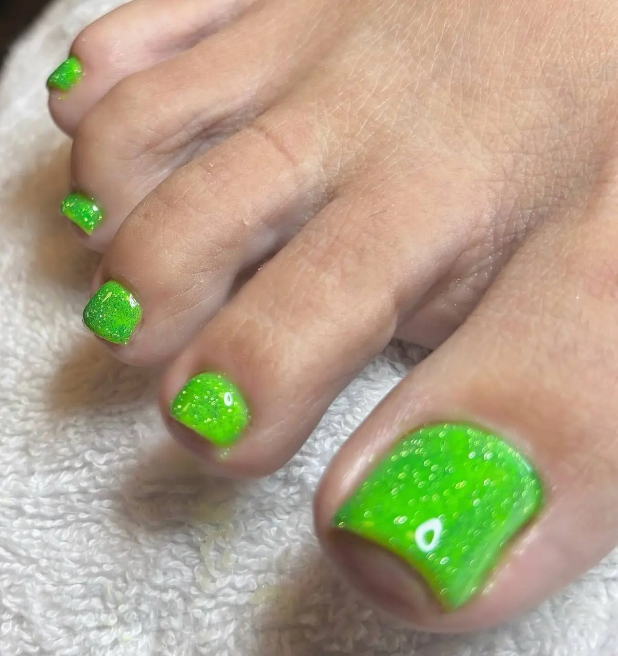 Neon green glitter pedicure at NailLou Salon