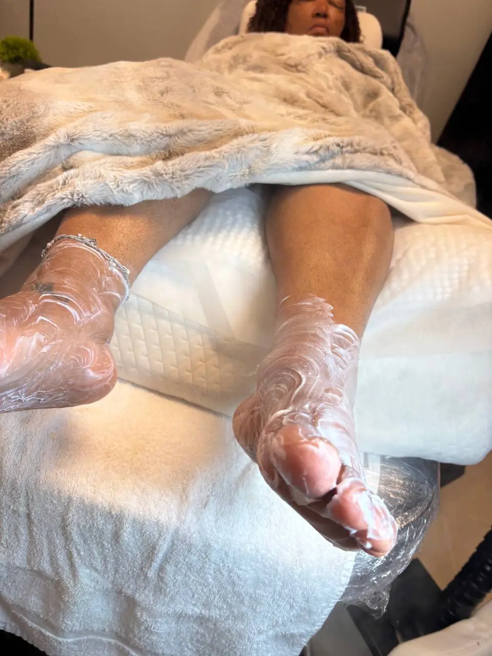 Paraffin foot wrap treatment at NailLou Salon